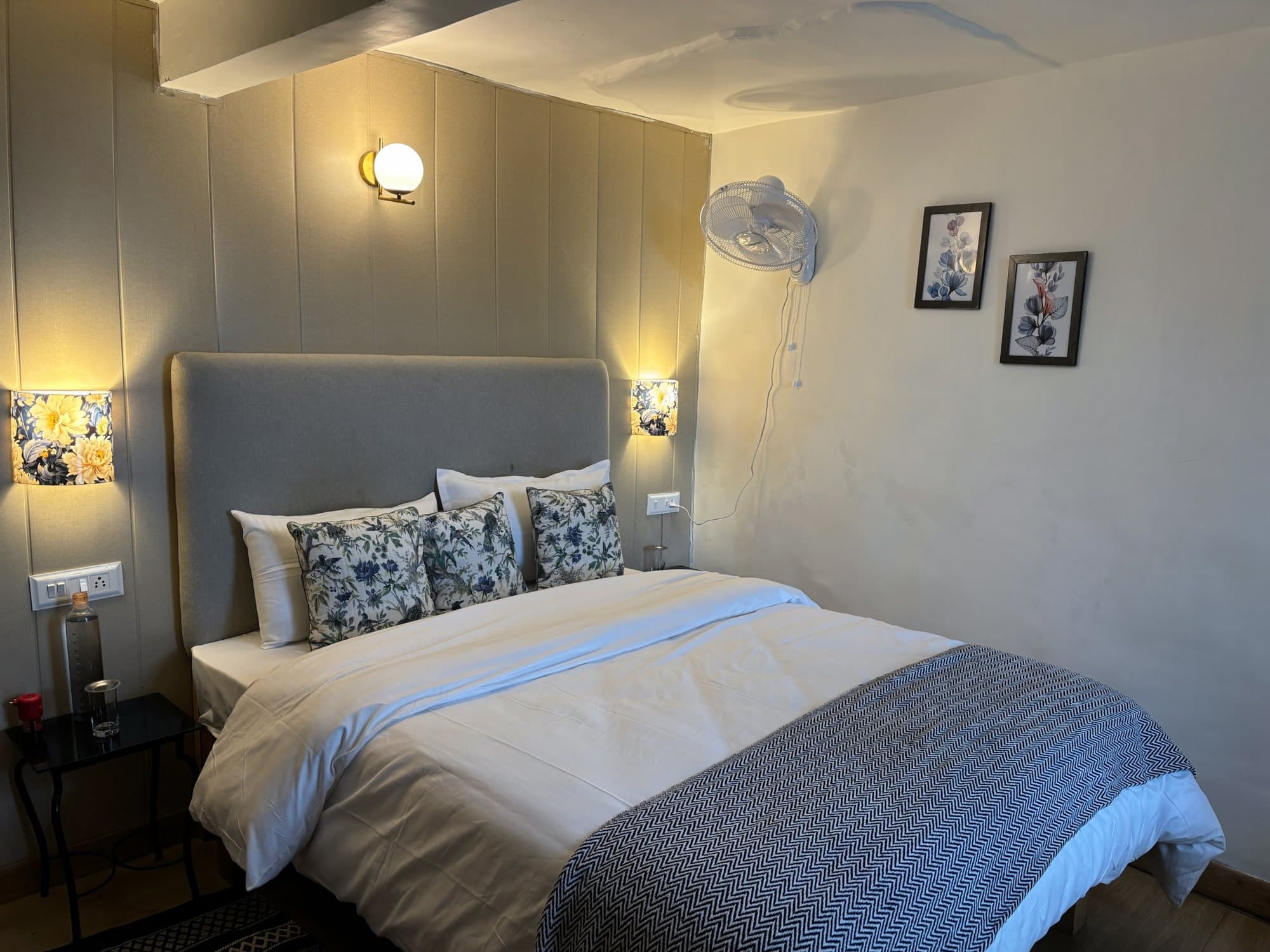 A blue throw, a window to the deodar at Shail Shikhar Cottage, Mussoorie