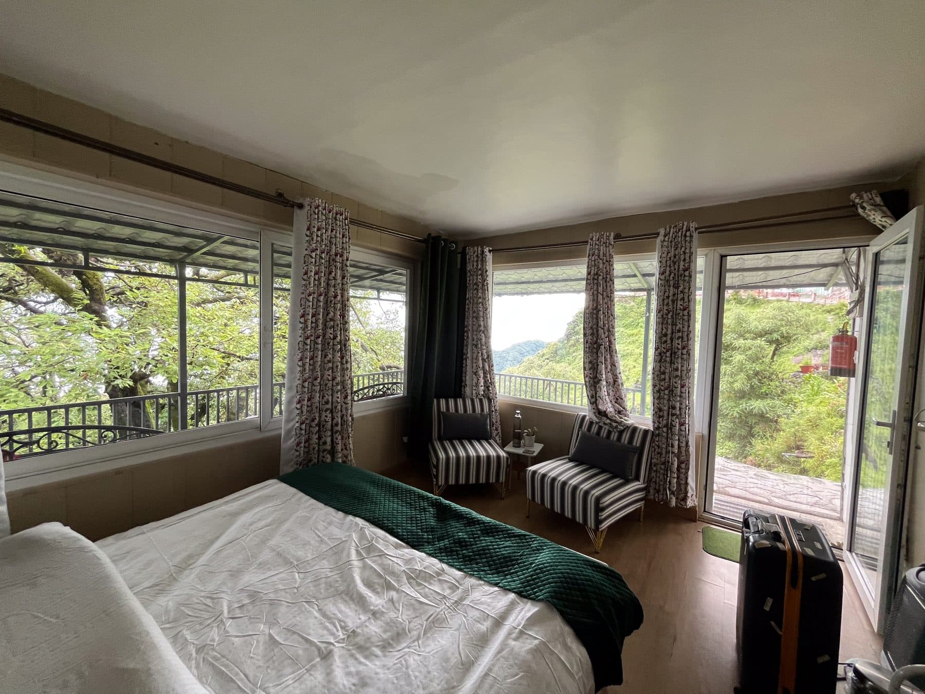 The green room, its door to the balcony at Shail Shikhar Cottage, Mussoorie