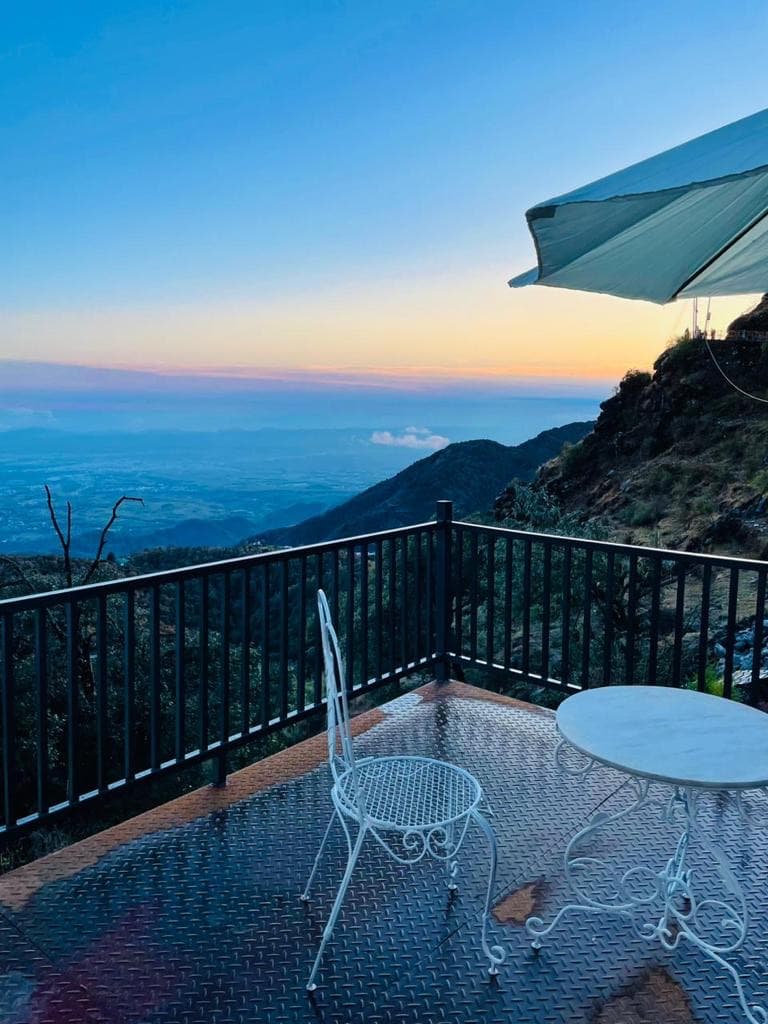 Sunset over the valley from a room balcony at Shail Shikhar