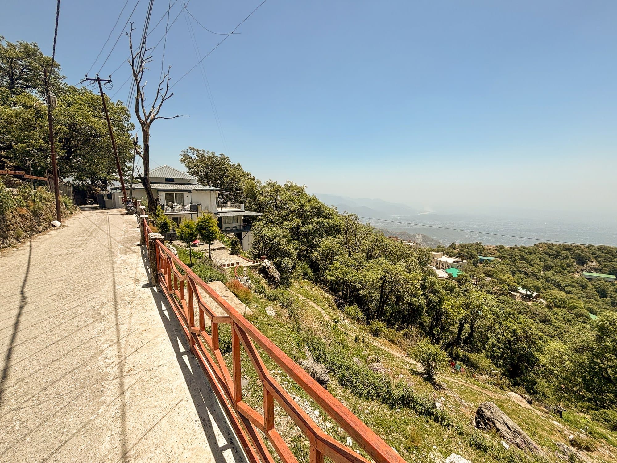 The road above Shail Shikhar with the valley falling away beyond a railing